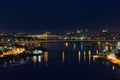 Night view of the Golden Horn sea bay, bridges, mosques, the historical center of Istanbul. The lights on in the houses.